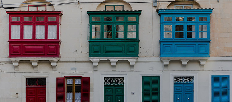 Colored city windows - Iuris Malta Law Firm